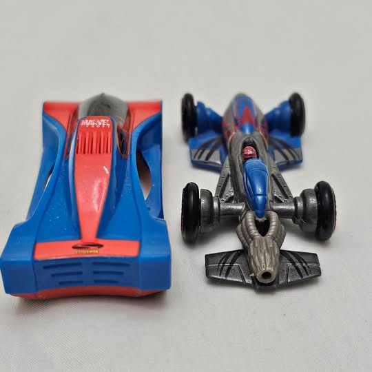 Blue and red diecast race car with open cockpit and four black wheels