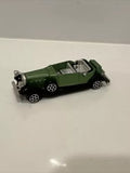 Green Packard diecast toy car with silver grille and detailed interior