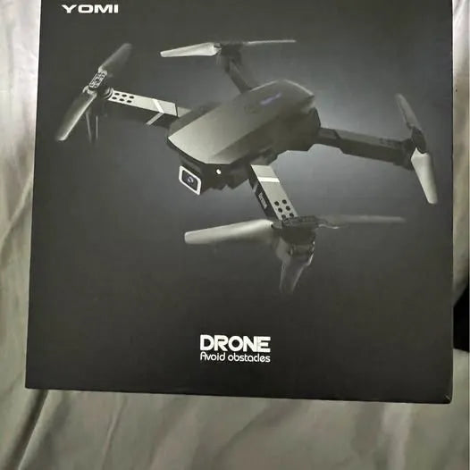 YOMI drone product box with multi-rotor drone illustration and DRONE text