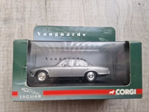 Silver 1:43 diecast car model in retail box with Jaguar branding