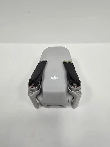 DJI drone with front propellers, gray body and rear camera housing