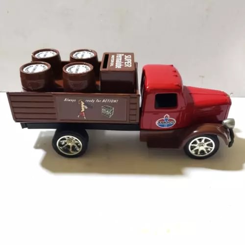 Ertl Amoco 1:25 scale diecast stake truck with red cab and brown bed, loaded with barrels