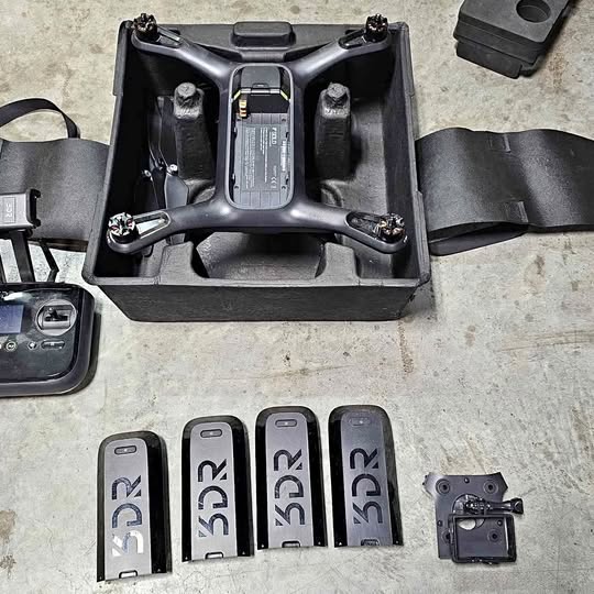 3DR Solo drone in black foam case with four battery modules and charger dock