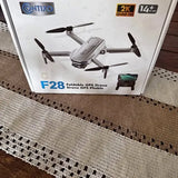 Foldable GPS drone packaging with quadcopter image, 2K Quad HD and 14+ min