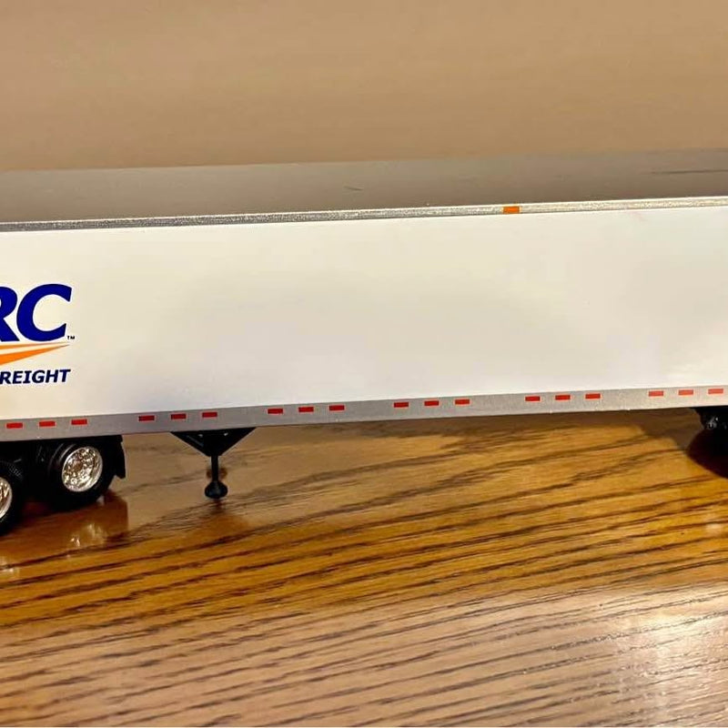 Diecast freight trailer replica with white side panel and red stripe details