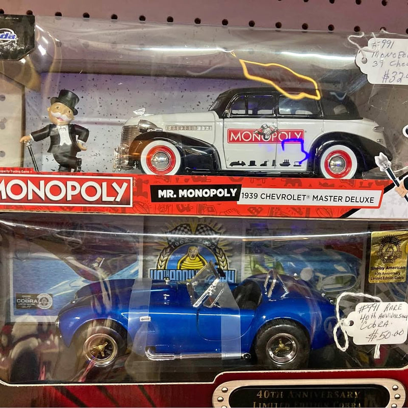 Diecast metal car set in retail box, blue and white with Monopoly graphics.