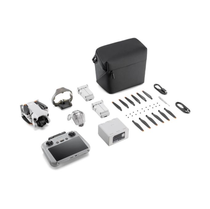 Mini drone kit with controller, batteries, spare props, and carrying case
