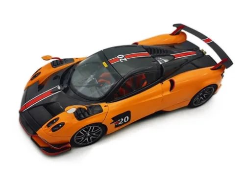 Orange and black die-cast sports car model with open cockpit and rear spoiler