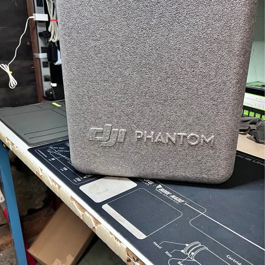 Gray textured drone carrying case with DJI PHANTOM logo