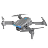 Foldable quadcopter drone with propellers, front camera, and blue status light