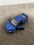 Blue die-cast model car with open door, 1/36 scale.