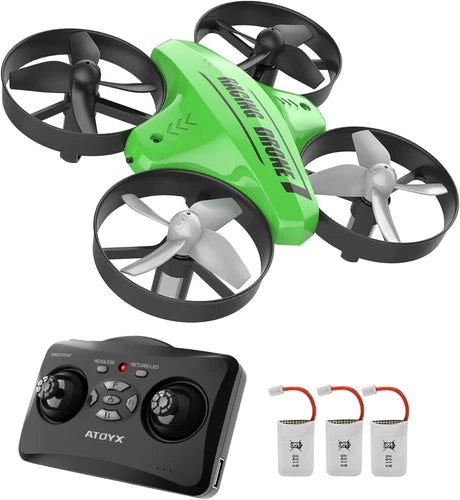 Green mini quadcopter drone with four propellers, paired with black RC controller and 3 batteries