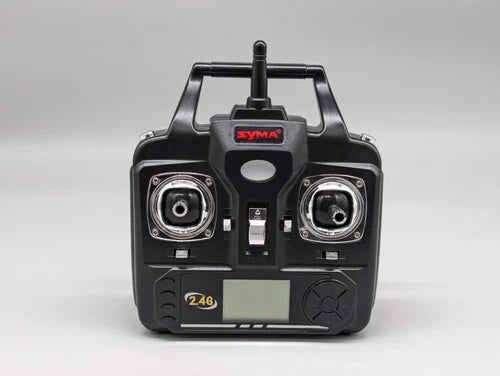 Syma drone transmitter remote, black 2.4G, front with antenna and dual controls