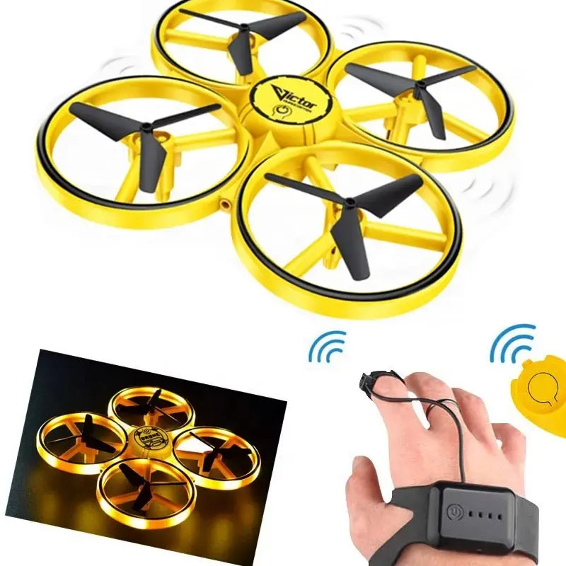 Yellow mini quadcopter drone with four propellers and LED lights; hand uses watch controller