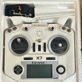 White RC drone transmitter with dual joysticks, screen, and control buttons