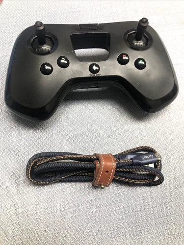 Drone controller with dual thumbsticks, buttons, and wrapped wrist strap cable