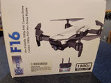 FPV quadcopter drone with camera, shown on retail box, four propellers