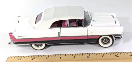 Packard Caribbean diecast car in white with pink side stripe, 1/24 scale