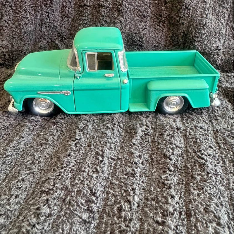 Green 1955-style diecast pickup truck with step-side bed