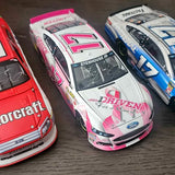 Pink and white diecast race car model with Stenhouse Jr branding and number decals