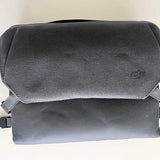 DJI drone bag with textured fabric, fold-over flap, and small gray logo