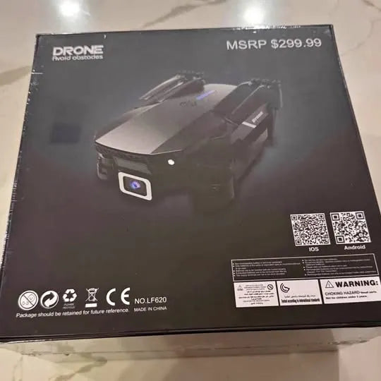 Black folding quadcopter drone box with mounted camera and QR codes