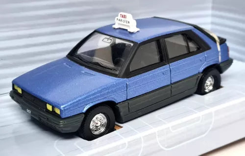 Corgi diecast scale model taxi car, light blue with black trim, front-left view.