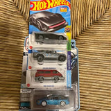 Diecast car lot in blister pack with four cars, blue and gray details