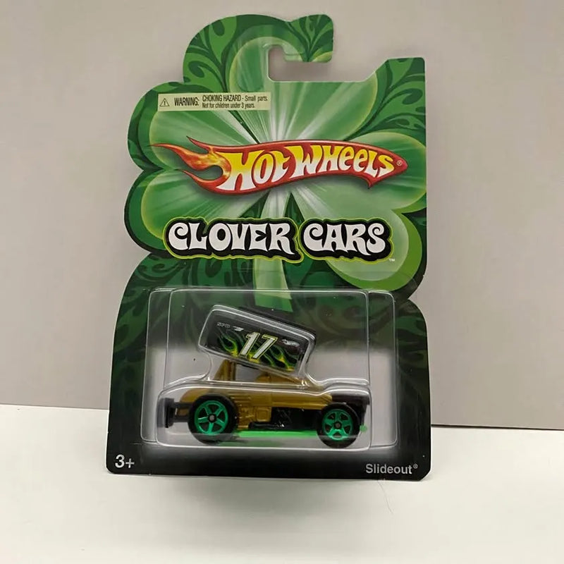 Gold and green Hot Wheels diecast car with black details, on Clover Cars Slideout card