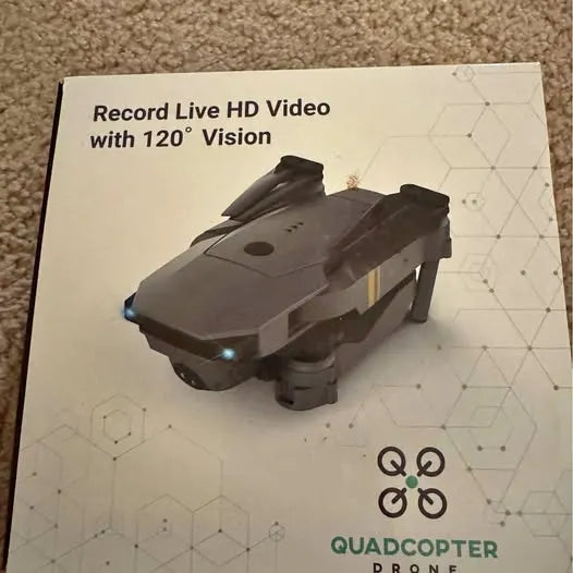 Quadcopter drone with mounted camera, front LED light, four rotor arms