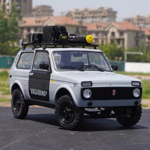 Diecast SUV model car with black hood and roof rack, white body and front grille