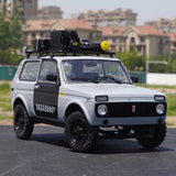 Diecast SUV model car with black hood and roof rack, white body and front grille