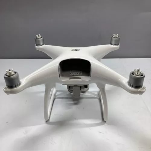 White quadcopter drone with front camera housing and four propeller arms