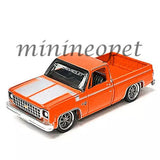 Orange 1980 Chevy Silverado pickup truck diecast toy, front 3/4 view