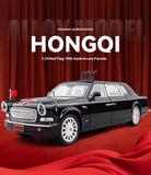 Black diecast limousine model car with chrome grille, white wheels, and red emblem
