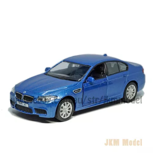 Blue alloy diecast model car, front 3/4 view with detailed grille and wheels