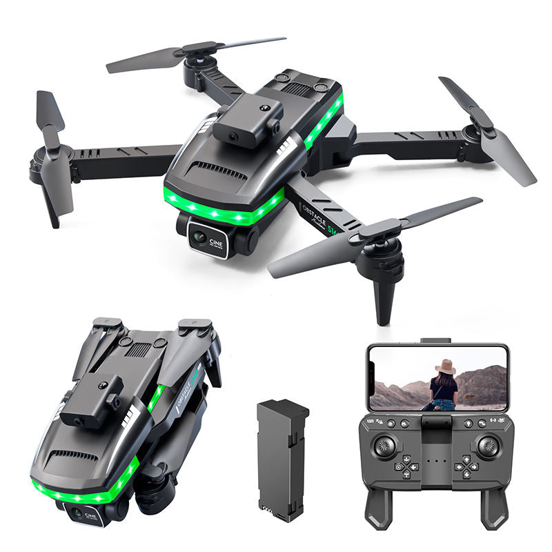 Black FPV drone with green LED lights, 4 rotors, and remote controller