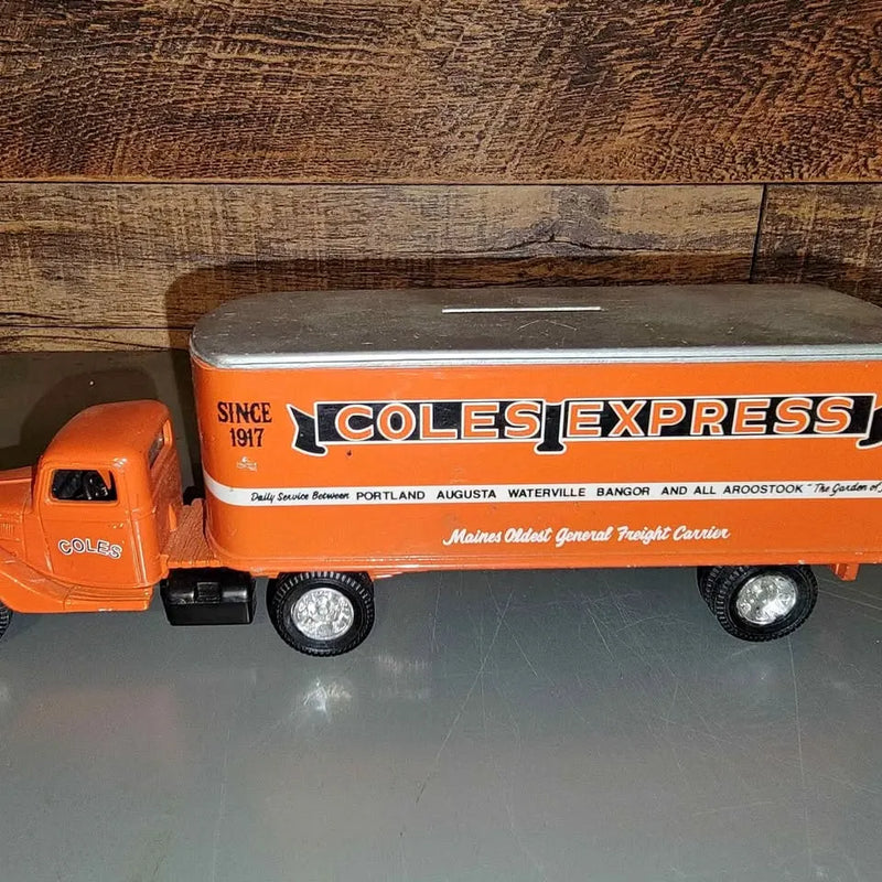 Orange diecast Coles Express truck bank with logo and detailed cab