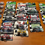 NASCAR Kyle Busch diecast car in box, green black 18 car with Skittles graphics