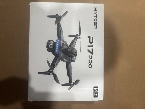 Gray quadcopter drone with 4K camera, folded propellers, in retail box