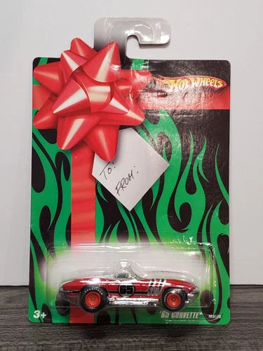 Hot Wheels 1:64 diecast Corvette in blister with red bow and flame design
