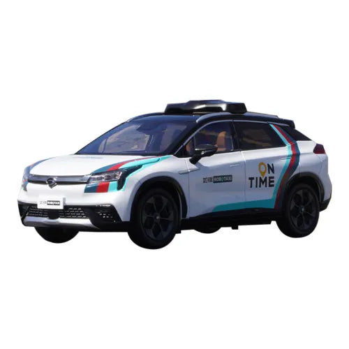 1:18 diecast robotaxi car model in white with blue stripes, black wheels, detailed body