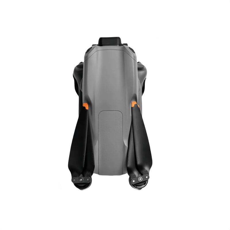 Grey quadcopter drone with folded arms and camera housing