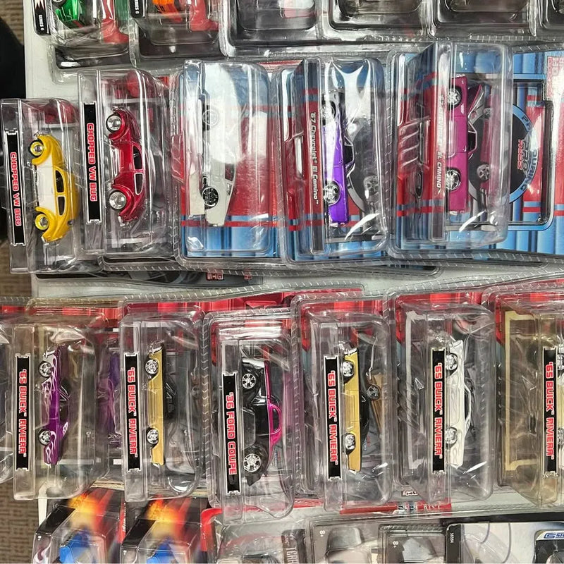 Diecast toy cars in blister packs, assorted colors with detailed wheels
