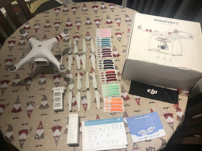 DJI Phantom 3 drone with remote, accessories, and retail box