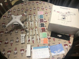 DJI Phantom 3 drone with remote, accessories, and retail box