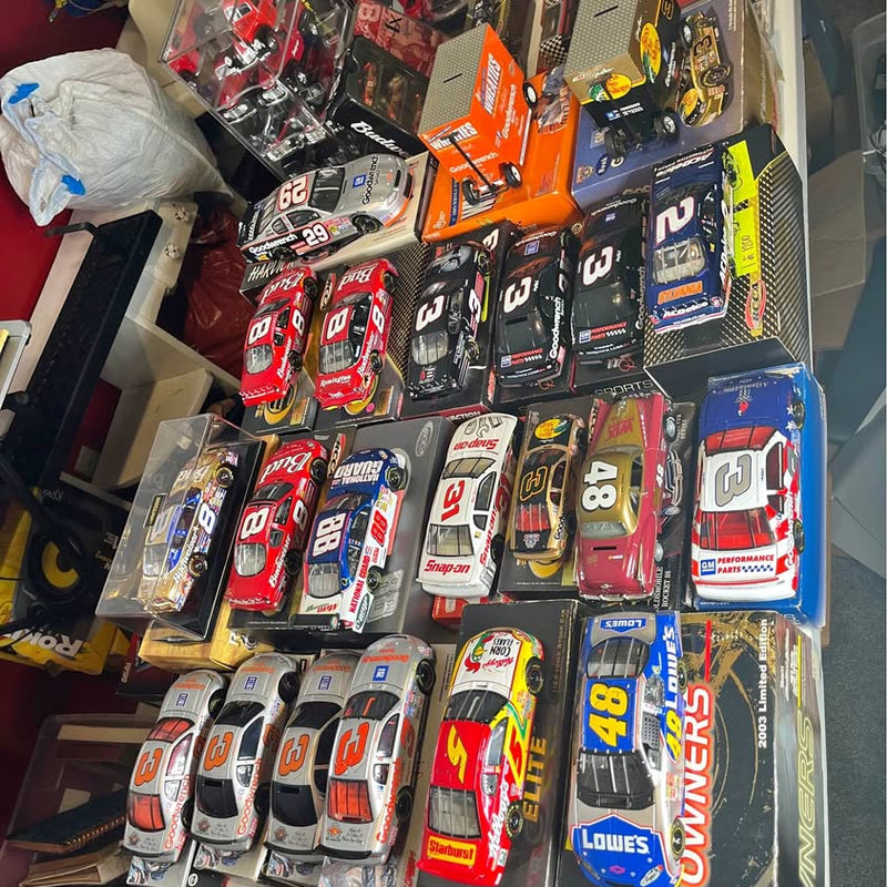 Assorted NASCAR diecast race cars, each in retail box with visible numbers and logos