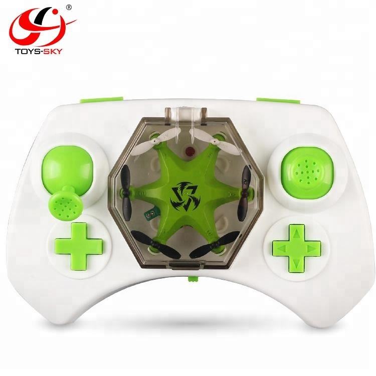 White mini RC drone remote with green buttons and center star-shaped drone