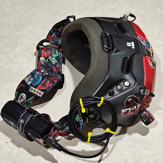 DJI goggles V2 black VR headset with patterned head strap and connected cables
