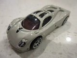 Gray diecast toy race car, Hot Wheels style, 1:64 scale, front three-quarter view